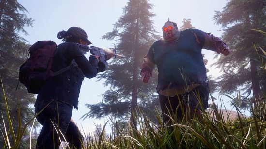 A lady with an assault rifle faces off against a big zombie in State of Decay 2, one of the best zombie games on PC